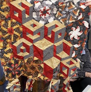 Jill started 20 years ago hand pieced hexagon blocks using chook fabric- bought at first quilt show she attended
