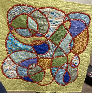 Helen has completed quilt but needs to bind it - 5 years ago for grandson