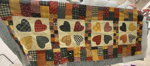 Sue started table runner in 1980s just needs to be quilted