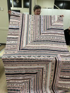 Roz completed piecing front of quilt backing will be black